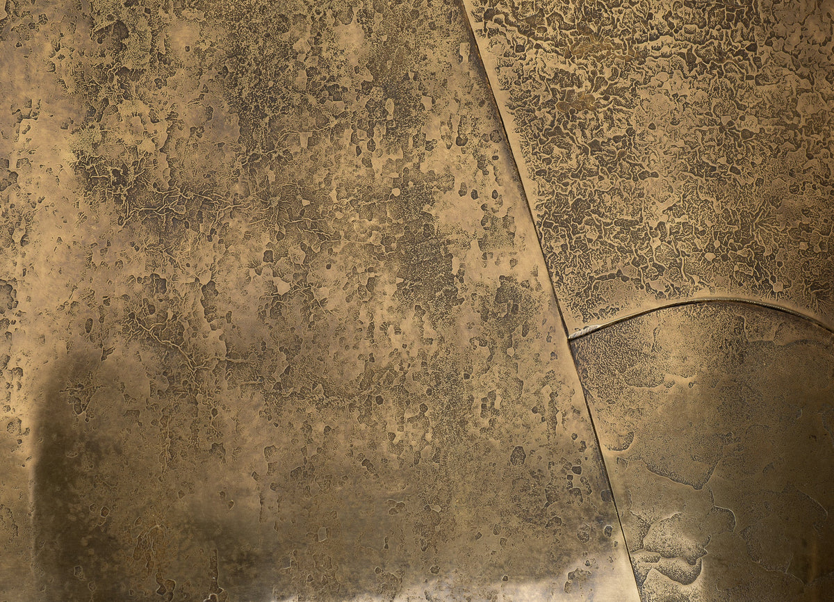 Detail of the textured surface and seams of Veil's brass seat.