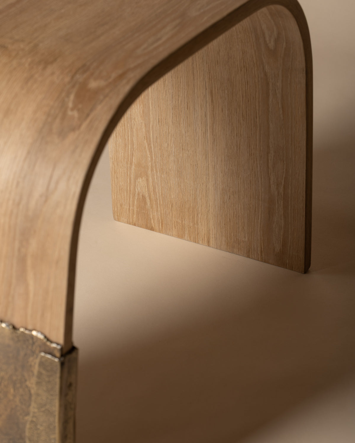 Detail of Brume's curved oak seat and the opening beneath it.